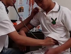 Twink gets fucked in the ass with a toy while being urinated on.