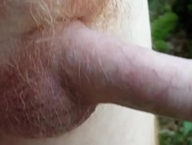 Amateur guy shows off his big cock and hairy balls outdoors
