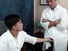 Young Asian doctor gets a surprise from his colleague at the office.
