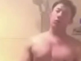 Asian man performing solo on webcam