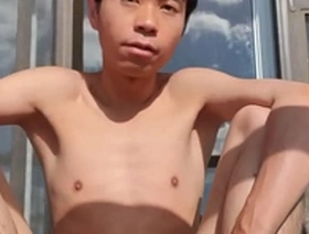Young femboy masturbates on the balcony of his car.