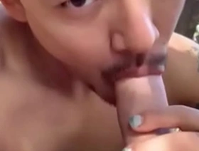 A Japanese woman gives a blowjob in the mountains while she is naked.