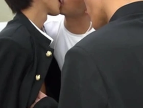 Young Japanese boy gets anal sex with two big cocks in a threesome scene.