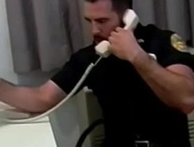 Manly cop fucks a horny gay stud in his office